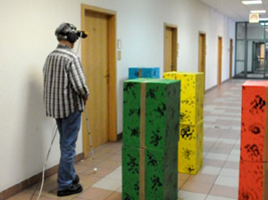 Figure 4. Prototype ETA used by a blind volunteer in an obstacle avoidance and orientation trial.